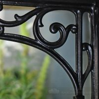 Detailed image of scroll pattern on cast iron bracket Detailed image of scroll pattern on cast iron bracket