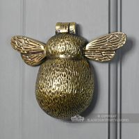 Honey Bee door knocker on grey door
