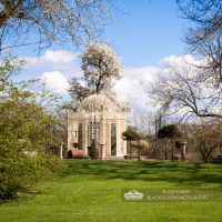 Parkland grounds with large cream pavilion