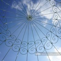 Domed roof scrolled metalwork on gazebo