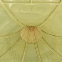 Detailed image of intricate scroll work on underside of roof Detailed image of intricate scroll work on underside of roof