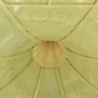 Detailed image of intricate scroll work on underside of roof