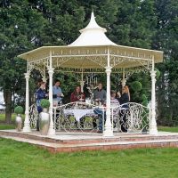 Cream garden gazebo on patio octagonal shape