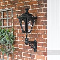 Black wall light on brick wall Black wall light on brick wall