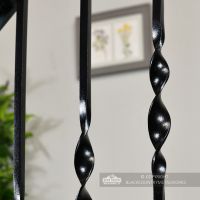 Detailed image of satin black wrought iron spindles