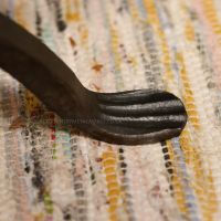 Close up of foot on log holder