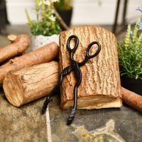 Beautiful hand forged wood burner tongs can be used for coal