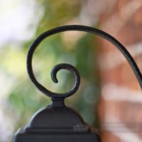Blacksmith curl on top of wall lantern Blacksmith curl on top of wall lantern