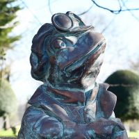 Close up of wind & willows Toad bronze effect garden sculpture Close up of wind & willows Toad bronze effect garden sculpture