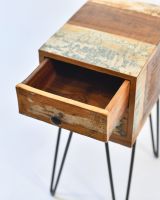 Close up of open drawer detail on bedside table