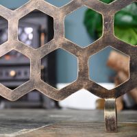 Close-up of the Antique Gold Finish on the Bee Fireguard