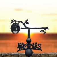 Beehive on Branch Weathervane with the sunset in the Background