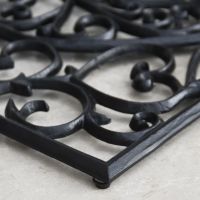 Close-up of the "Belleview" Rectangle Heart Doormat on a Tiled Floor