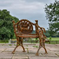 Rear view of Cast Iron Rustic "Dog" Single Seat Bench