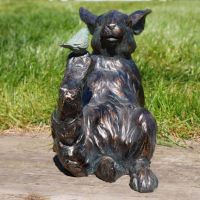 View From the Front of the Bird Sitting on Rabbit Garden Sculpture