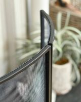 Close-Up of Black "Fortress" Curved Three Fold Fireguard in Situ