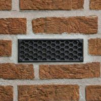 Black "Honeycomb" Cast Iron Air Brick in the Home installed