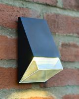 Black angled wall light turned on