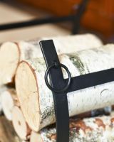 Close Up Of Black Blacksmith Curved Log Rack Close Up Of Black Blacksmith Curved Log Rack