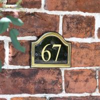 Vinyl Black & Brass Arched Number Sign in situ on the Frpont of a House