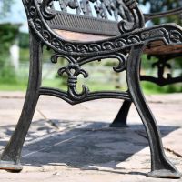 Close up of Aged Black Cast Iron Frame and Bench Legs