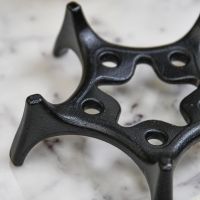Close-Up of Black Cast Iron Japanese Star Teapot Stand