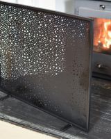 Close-Up of Black Circular Cut-Out Single Panel Fire Guard