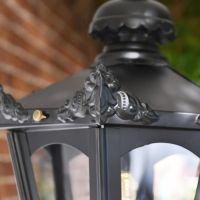 Victorian Ornate Finals on the Lid of the Chain Hanging Lantern Victorian Ornate Finals on the Lid of the Chain Hanging Lantern