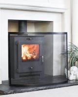 Black Contemporary Curved Single Panel Fire Guard In Front Of A Wood Burner
