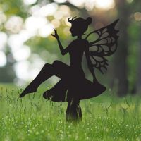 Flower Fairy Sitting on Toad Stool Silhouette in Situ in the Garden