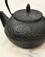 Close Up of Black Floral Teapot
