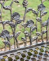 Close-Up of Rose Backrest on Black & Gold Rose Design Bench