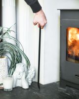 Scale Shot Of Black Hooked Fireside Poker Scale Shot Of Black Hooked Fireside Poker