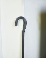 Close Up Of Black Hooked Fireside Poker Handle Close Up Of Black Hooked Fireside Poker Handle