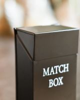 Close Up Of Black Metal "Match Box" Holder
