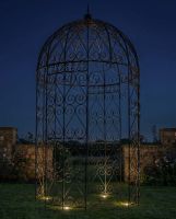 Black ornate scroll gazebo in garden Digital Illustration At Night Black ornate scroll gazebo in garden Digital Illustration At Night