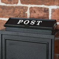 "Post" Written on the Letter Flap on the Top of the Black "Oxford" Wall Mounted Post Box with White Text