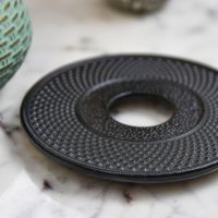 Close-Up of Black Round Cast Iron Trivet