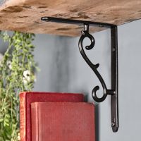Black Shelf Bracket Holding Up a Wooden Shelf 