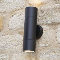 Antique Brass Spotlight Cylinder Wall Light in Situ on a Stone Wall