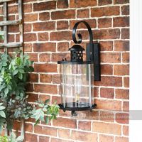 Black Suspended Cylindrical Lantern Installed On Wall Black Suspended Cylindrical Lantern Installed On Wall