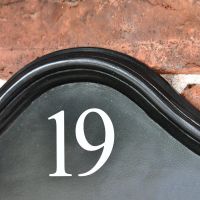 Arched Design on the Black Traditional House Name Sign
