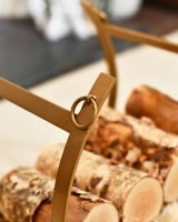 Close-Up of Blacksmith Brass Finish Curved Log Rack Close-Up of Blacksmith Brass Finish Curved Log Rack