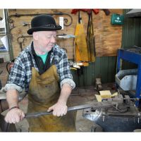 Blacksmith at work creating the Joist Hangers