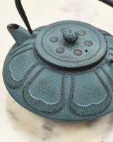 Close Up of Cast Iron Teal Embossed Teapot 