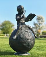 "Boy Reading on Top of the World" Sculpture in Situ
