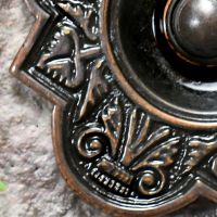 Detailed image of ornate cast pattern on Burnished Copper Bell Push