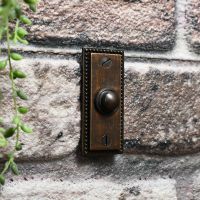 Burnished copper door bell with Georgian dot border
