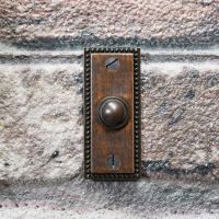 Period Bell buzzer button on wall