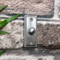 Rectangle period door bell on brick wall  Rectangle period door bell on brick wall